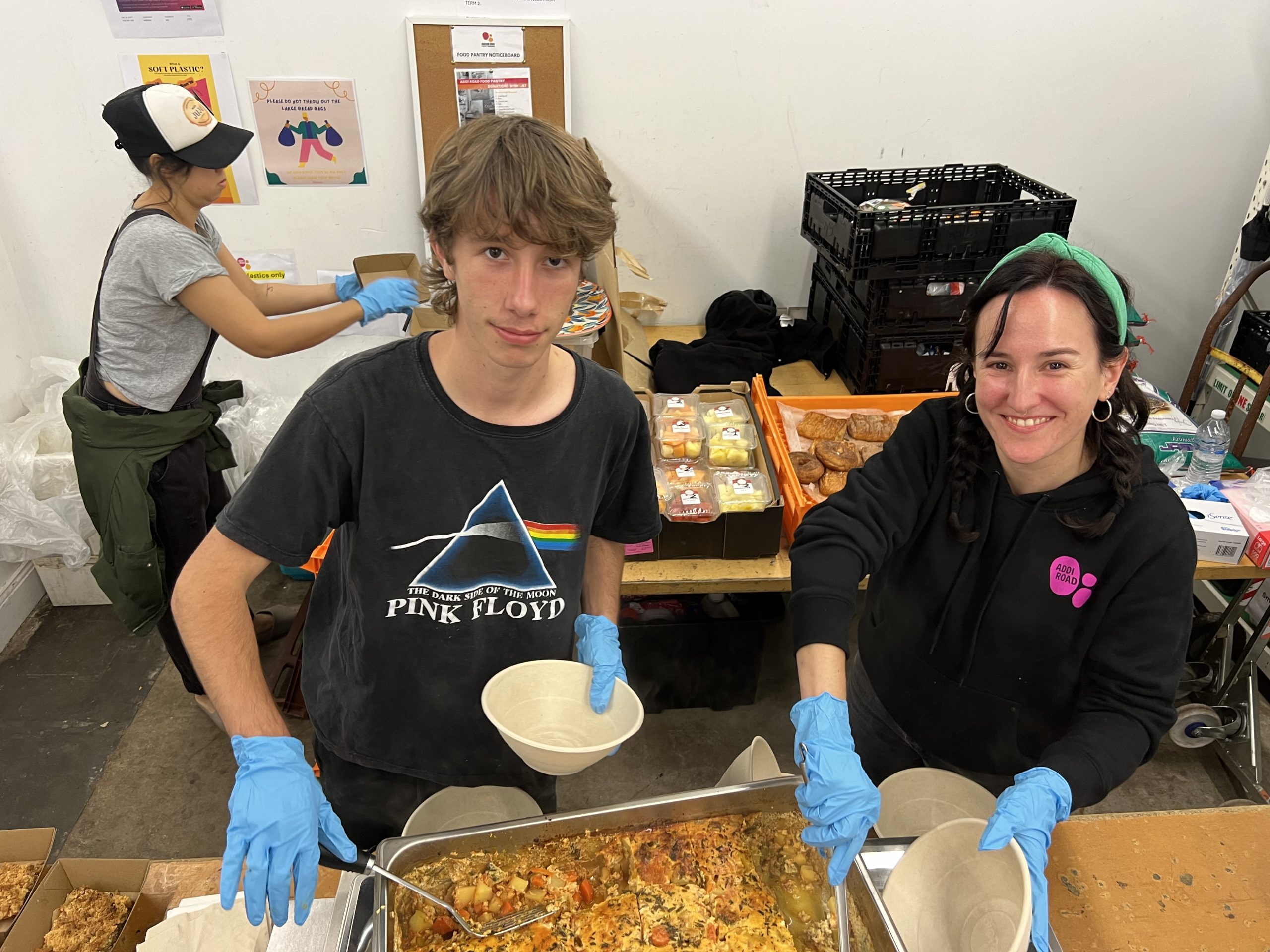 three volunteers serving customers at the addi road food pantry marrickville